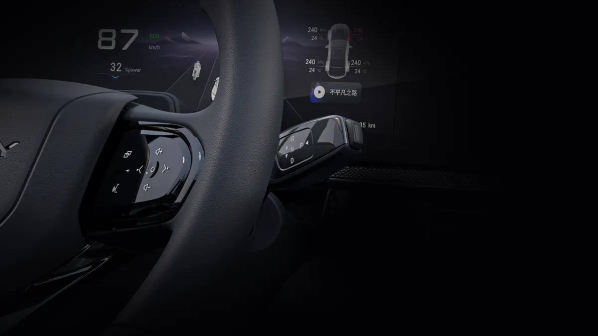 Omoda E5 — steering wheel control and gear selector detail